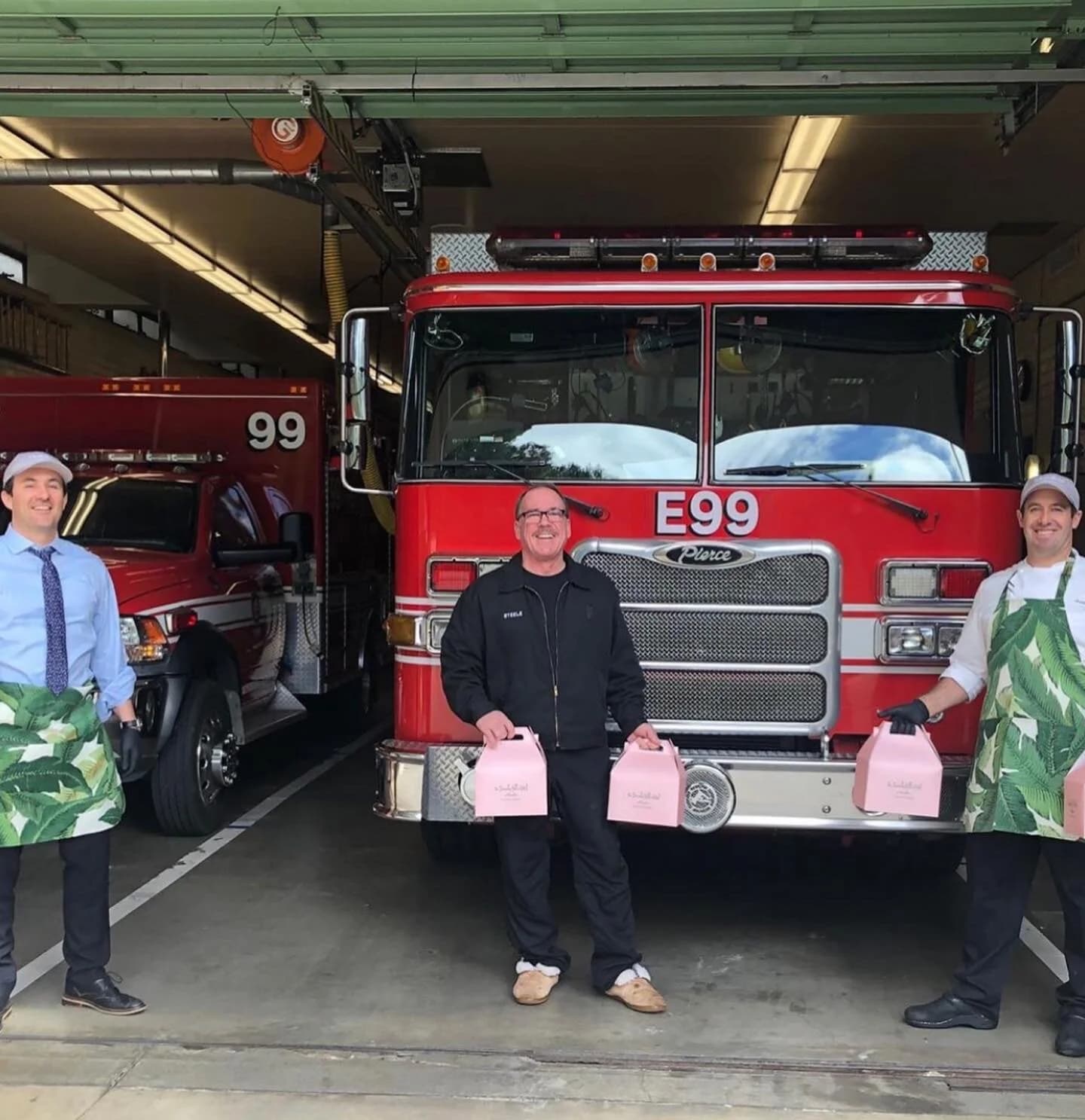 Beverly Hills firefighters wearing Tudaloo banana leaf aprons while donating food
