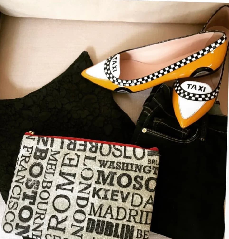 Tudaloo travel clutch styled with taxi print flats
